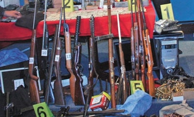Seized weapons outside Bolivia's Ministry of Government