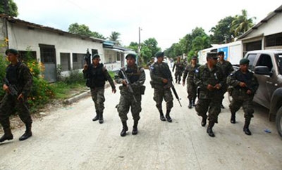 Soldiers patrol San Pedro Sula streets