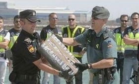 Spanish police unload the seized cocaine