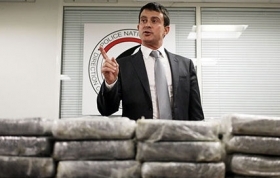 French Interior Minister Manuel Valls with part of the haul