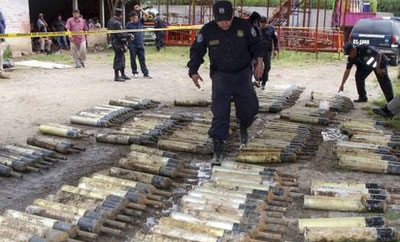 El Salvador police inspect the recovered grenades