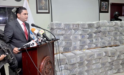 A Dominican official displays the latest drug haul