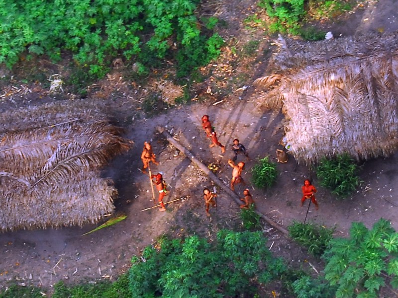 An uncontacted Brazilian tribe watches a government plane