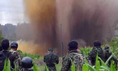Soldiers blow up a narco-airstrip in Peru's VRAEM