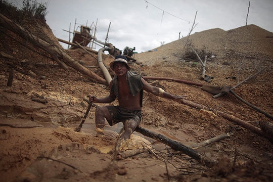A worker in an illegal gold mine in Peru