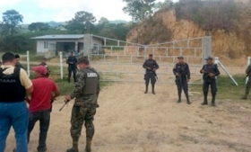 Honduras security officials guarding a drug lab