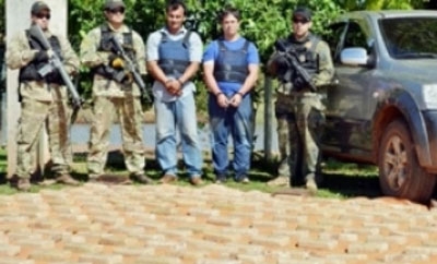 Two members of the gang with the seized drugs