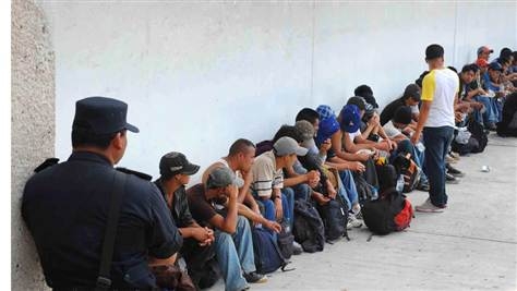 Migrants under guard in Mexico