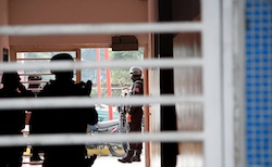 Venezuela police conducting a search