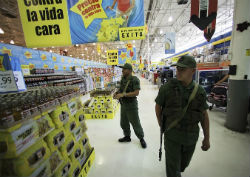 Venezuelan troops patrol a supermarket
