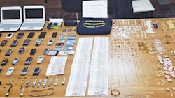 Phones and jewelry seized from the virtual kidnapping group