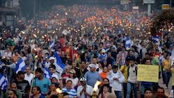 Protestors march in Tegucigalpa