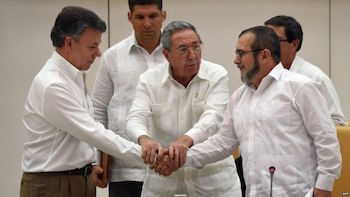 President Santos (left) and FARC Commander "Timochenko" (right)