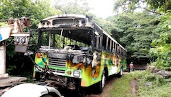 A bus burned by alleged gang members in El Salvador