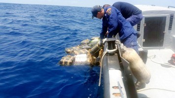 Costa Rican Coast Guard retrieving cocaine from a recent interdiction
