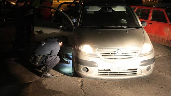 Argentina police inspect a vehicle used in an express kidnapping