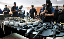 Honduran authorities with seized firearms