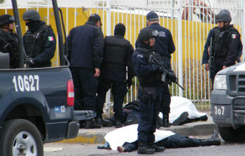 Police guard a crime scene in Ciudad JuÃ¡rez