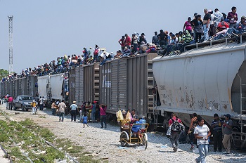 Migrants riding the dangerous Mexican train dubbed "The Beast"