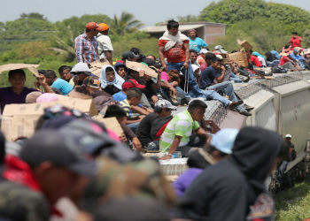 US-bound migrants riding on a Mexican freight train