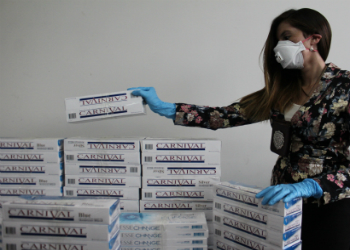 Chilean authorities with confiscated contraband cigarettes