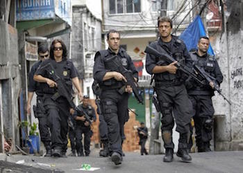 Police forces patrol a favela in Rio de Janeiro