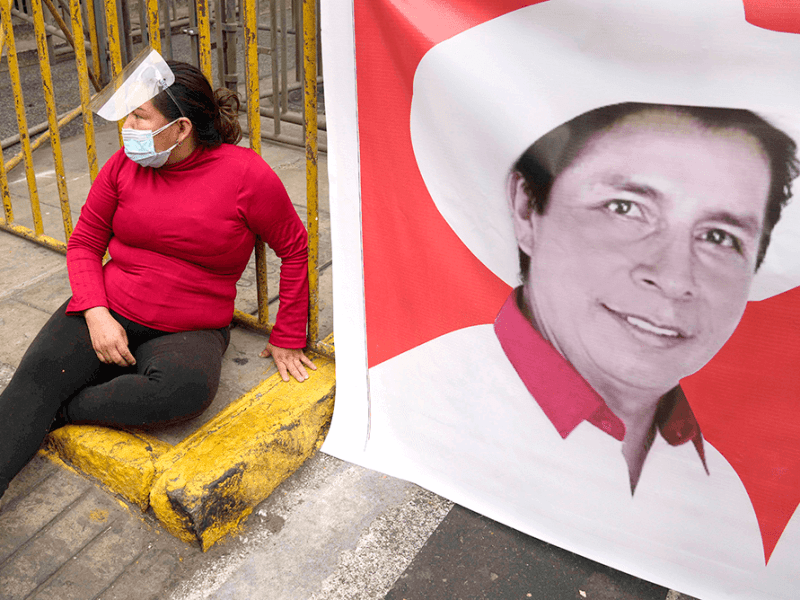 A supporter of Pedro Castillo rests during a march ahead of the country's election