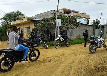 Police patrol the village of Posorja on motorbikes.