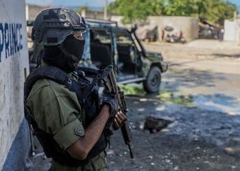 A Haitian soldier stands guard outside a government building in Port-au-Prince