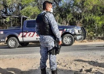 A policeman stands guard after a prison break in Hidalgo, Mexico
