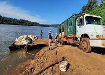 Argentine Officials, shown at the Uruguay River with an 11 ton seizure of contraband soy
