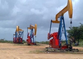 Three oil rigs painted in Venezuela's colors