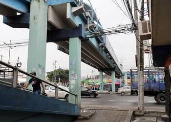 A footbridge over a busy road where two bodies were found hanging in Ecuador