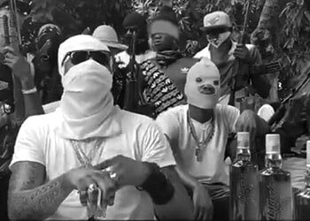 The leaders of 400 Mawozo, masked to conceal their identity