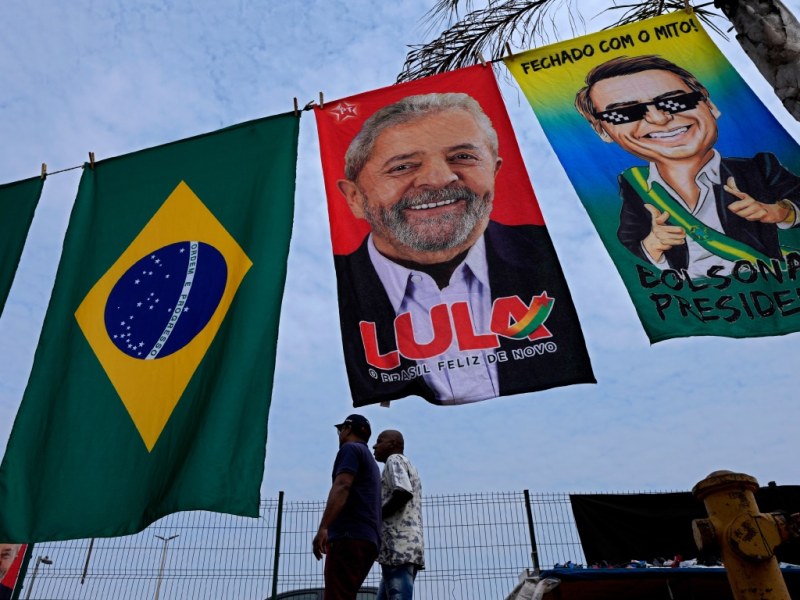 Banners featuring the faces of Jair Bolsonaro and Lula ahead of the Brazilian presidential election