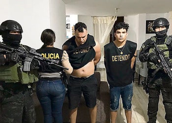Peruvian police show two arrested members of the Gallegos, a gang associated to Tren de Aragua