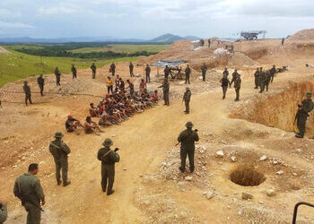 Venezuelan soldiers oversee the discovery of mass graves near an illegal mining site in Bolivar.