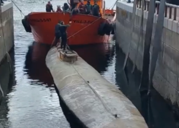 Spanish authorities shown inspecting a narco-submarine that likely carried cocaine to Europe.