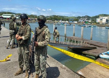 Security forces patrol dock were nine people were killed