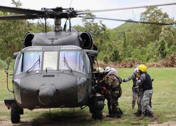 Colombian solders enter a helicopter in Cauca.