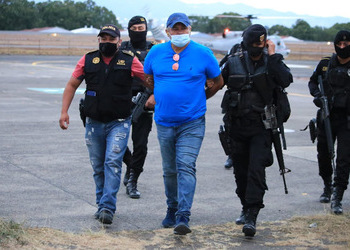 This photo shows ex-Guatemalan Colonel Otto Fernando Godoy Cordón led away by Guatemalan authorities.