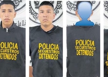 Extortionists detained by Peruvian police take their mugshots.