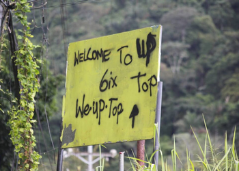 A sign in Upper Dibe Road, St James with the 6 or Sixx gang markings.
